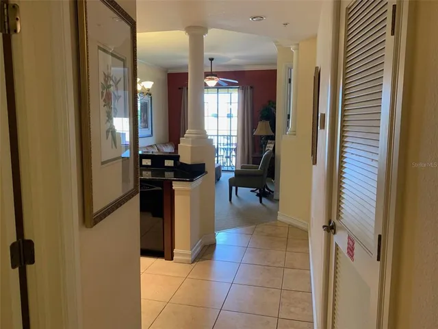 a kitchen with a refrigerator and cabinets