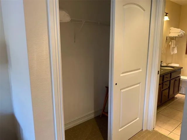 a view of a bathroom from a hallway