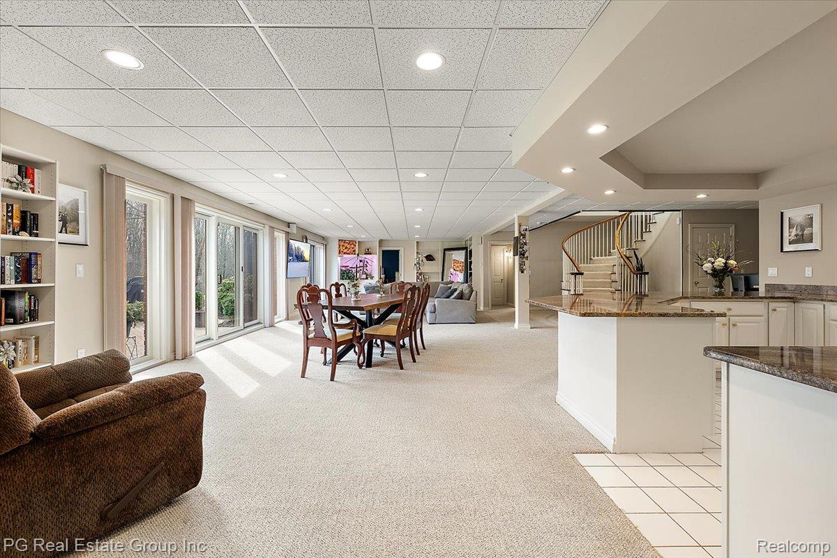 3571 Cedar Brook Drive Rochester, MI 48309 - Photo 50 of 57 Dining area featuring light colored carpet, recessed lighting, and a paneled ceiling