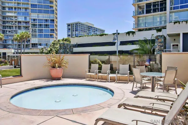 a view of a swimming pool with a lounge chair