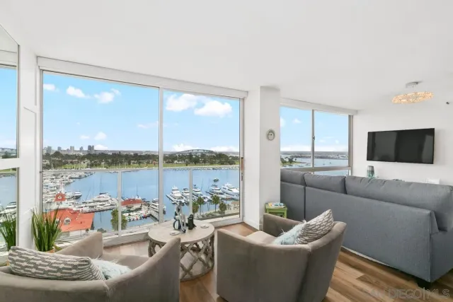 a bedroom with furniture and a flat screen tv