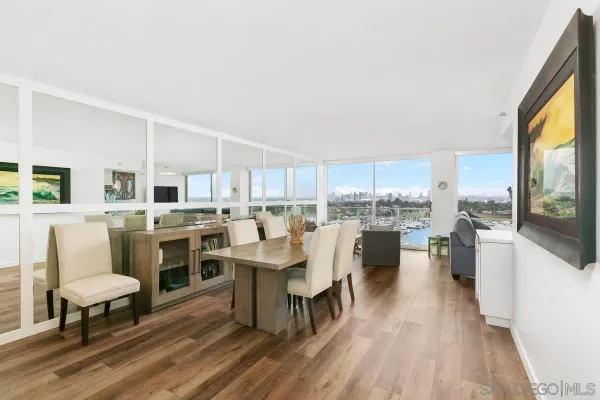 a large kitchen with stainless steel appliances a stove a sink dishwasher and cabinets with wooden floor