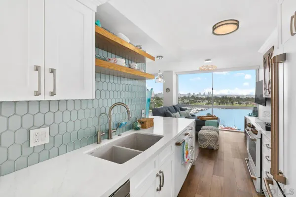 a kitchen that has a lot of cabinets in it