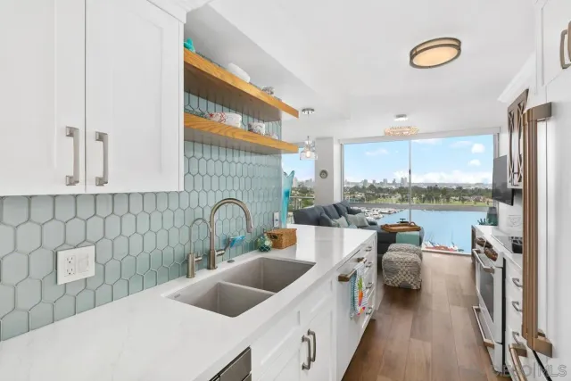 a kitchen that has a lot of cabinets in it