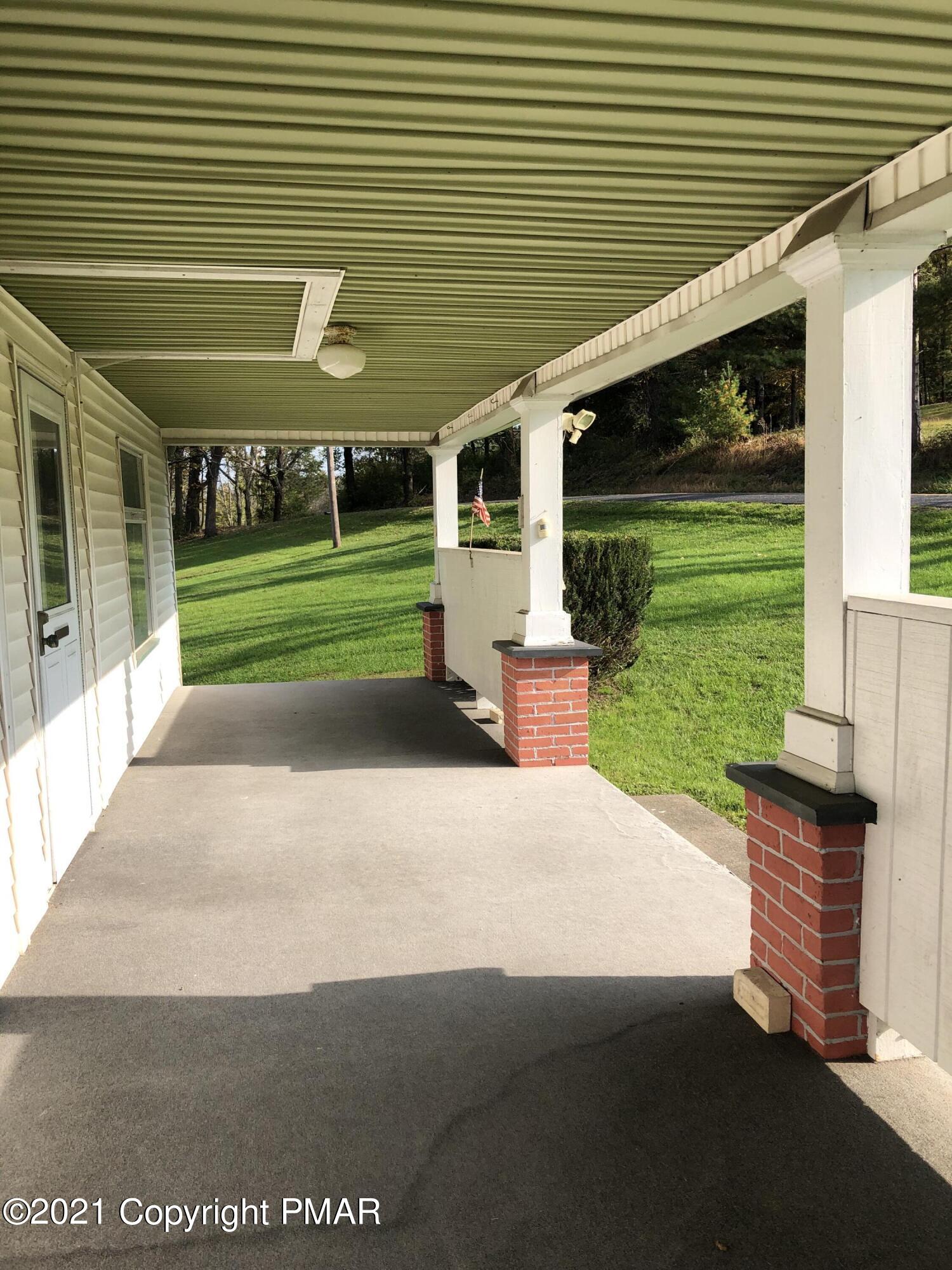 173 Anchorage Road Saylorsburg, PA 18353 - Photo 14 of 56 a front view of a house with a yard