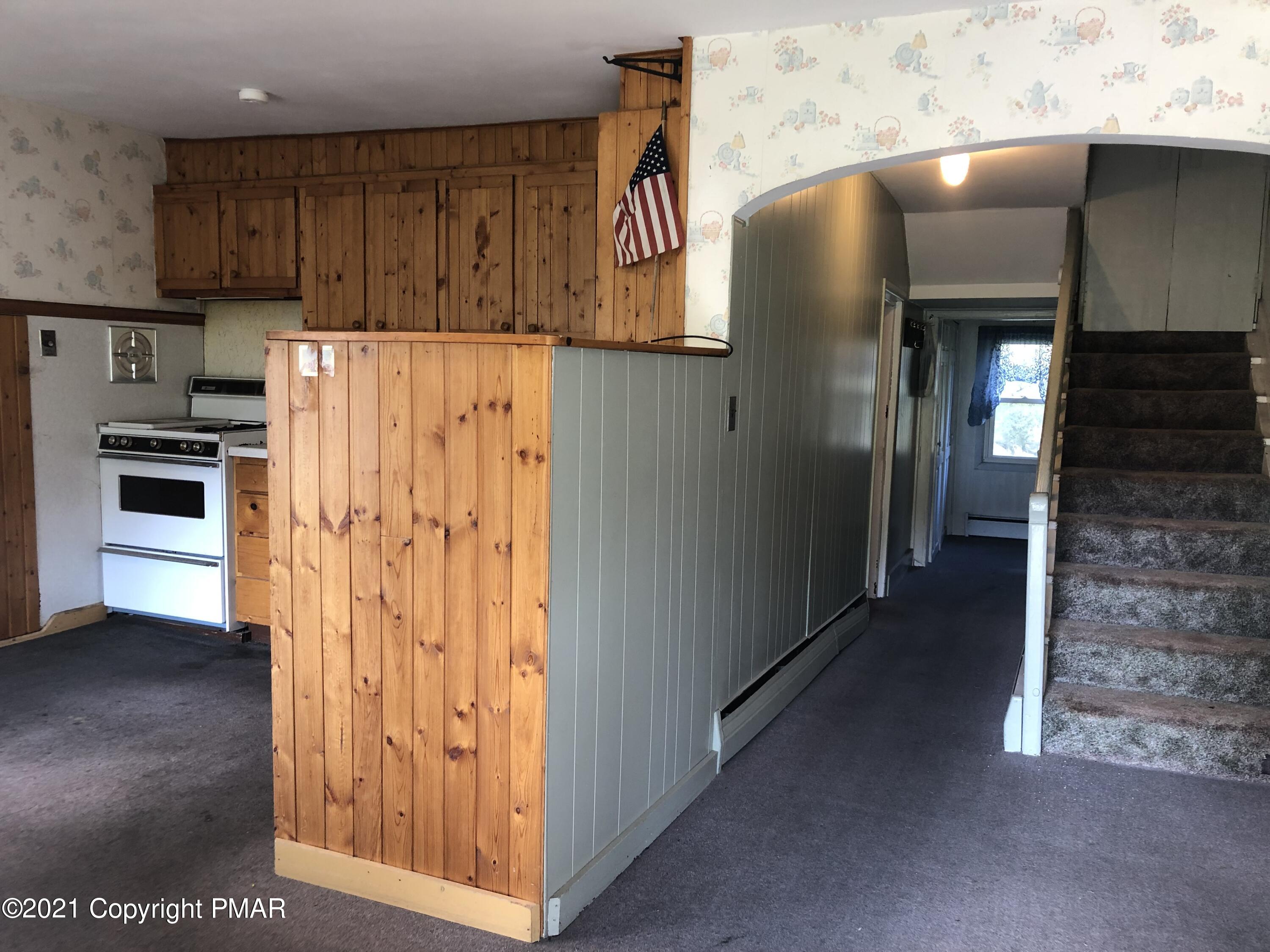 173 Anchorage Road Saylorsburg, PA 18353 - Photo 19 of 56 a view of a kitchen with stainless steel appliances granite countertop a refrigerator and a stove top oven
