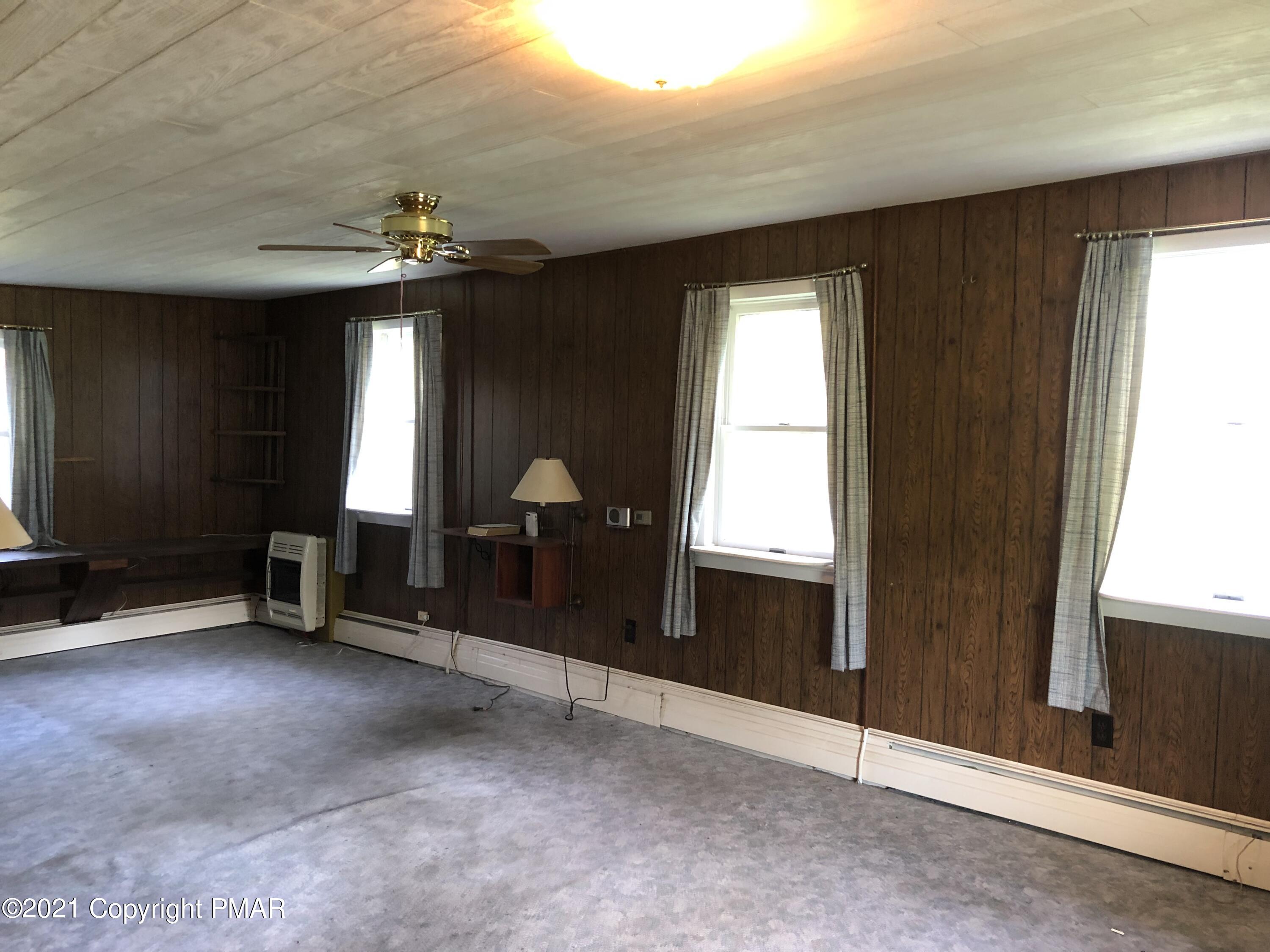 173 Anchorage Road Saylorsburg, PA 18353 - Photo 24 of 56 wooden floor in an empty room with a window