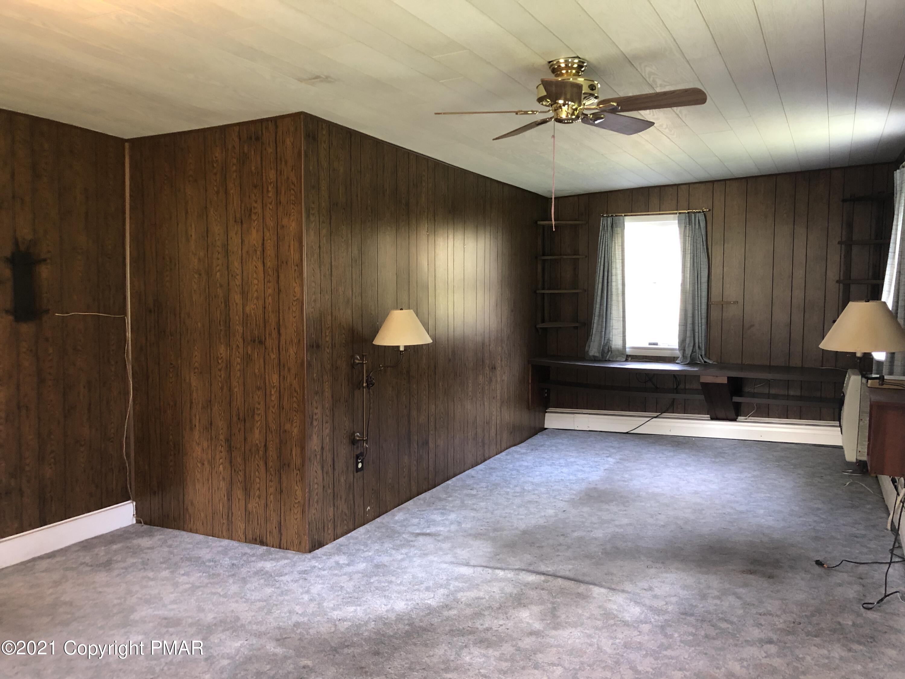 173 Anchorage Road Saylorsburg, PA 18353 - Photo 26 of 56 an empty room with windows and fan