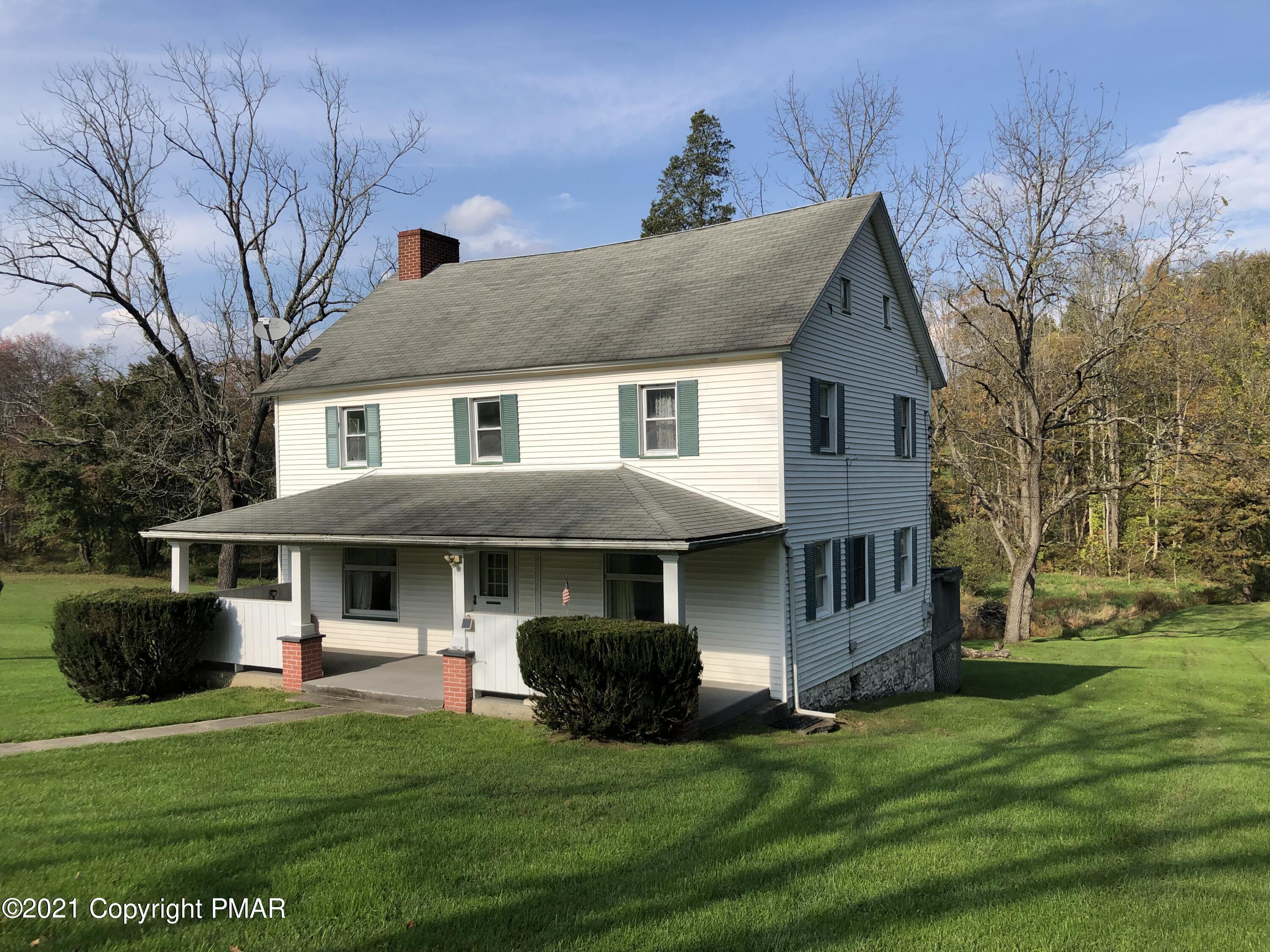 173 Anchorage Road Saylorsburg, PA 18353 - Photo 4 of 56 a front view of a house with a yard