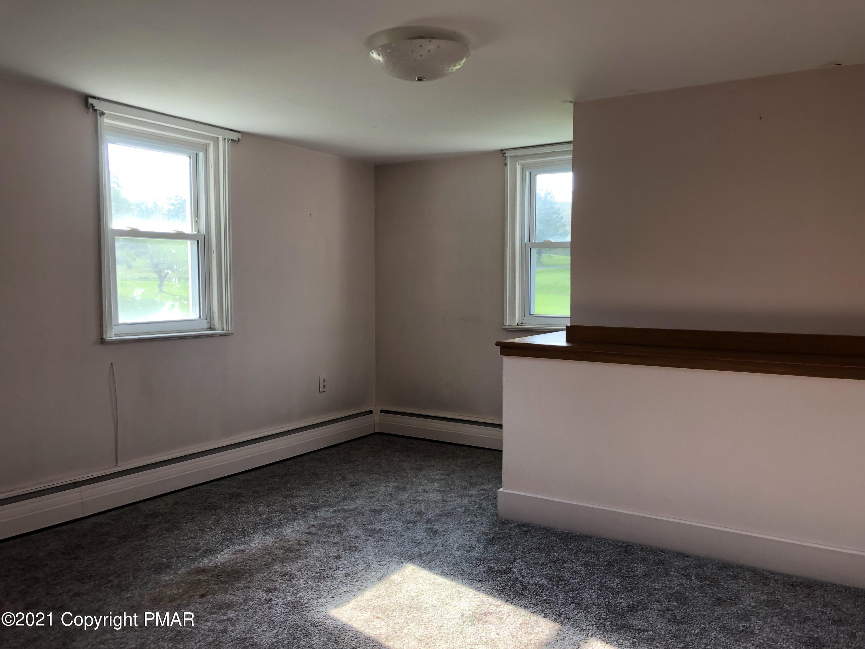 173 Anchorage Road Saylorsburg, PA 18353 - Photo 41 of 56 an empty room with windows