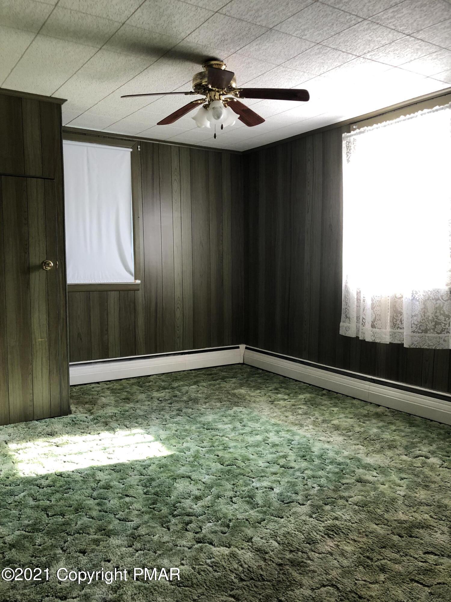 173 Anchorage Road Saylorsburg, PA 18353 - Photo 46 of 56 a view of a livingroom with a ceiling fan and window
