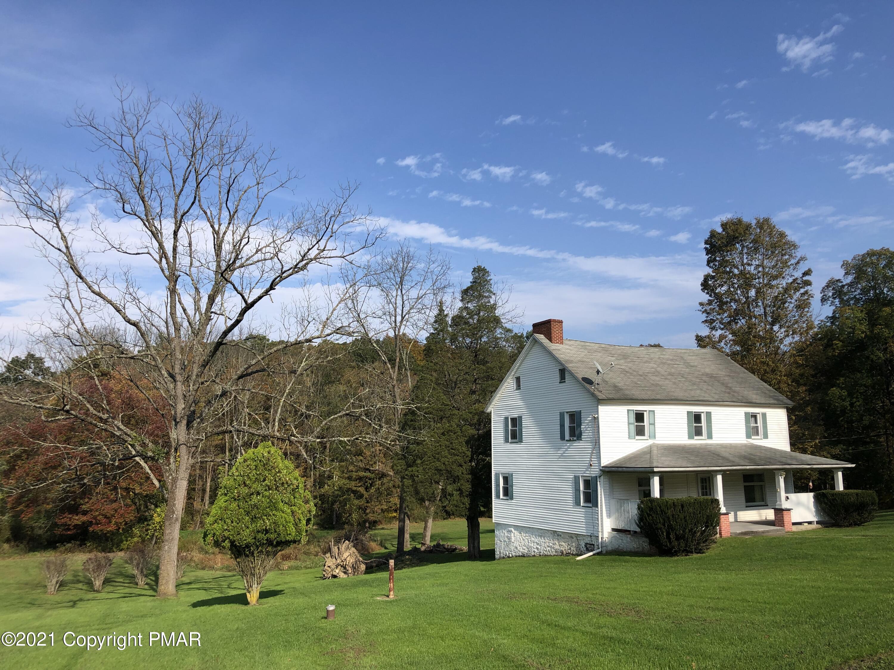 173 Anchorage Road Saylorsburg, PA 18353 - Photo 6 of 56 a front view of a house with a garden