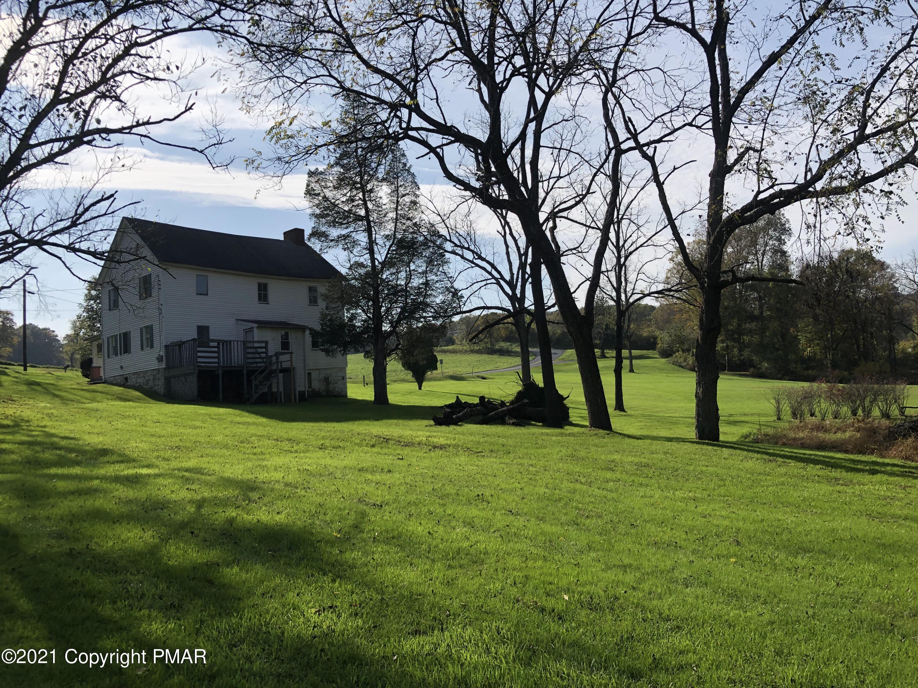 173 Anchorage Road Saylorsburg, PA 18353 - Photo 10 of 56 a view of a house with a big yard