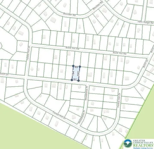 a white bath tub sitting next to a white wall