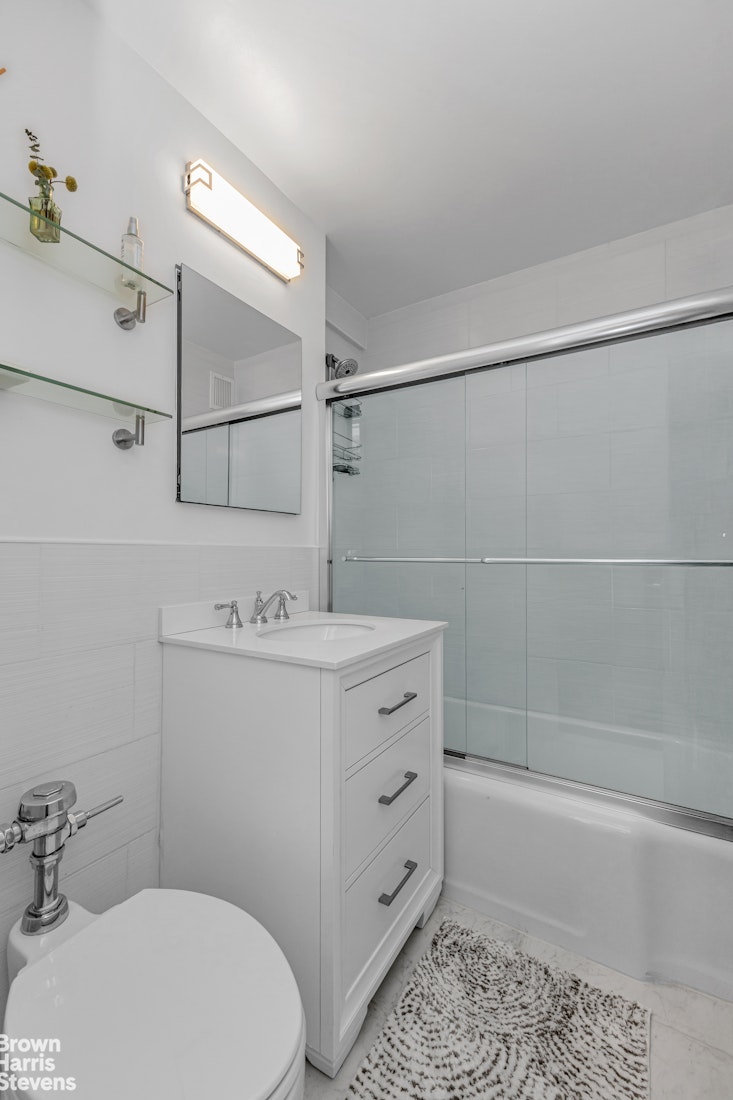 750 Park Avenue, Unit 3B Manhattan, NY 10021 - Photo 10 of 13 a bathroom with a sink a toilet and shower
