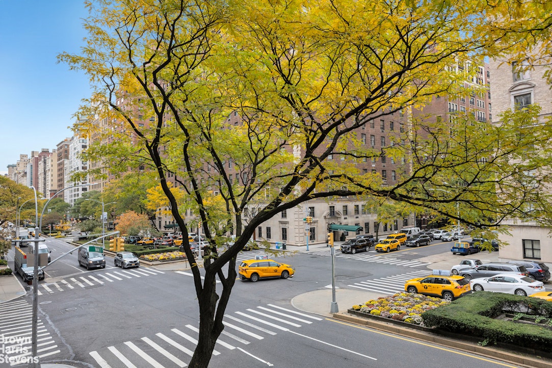 750 Park Avenue, Unit 3B Manhattan, NY 10021 - Photo 12 of 13 a view of city street with cars parked on the road