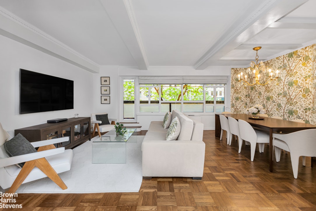 750 Park Avenue, Unit 3B Manhattan, NY 10021 - Photo 5 of 13 a living room with large couches and a flat screen tv