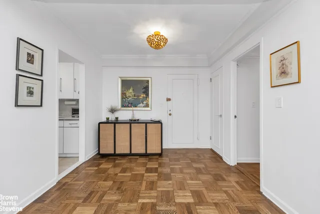 a view of kitchen cabinetry and wooden floor