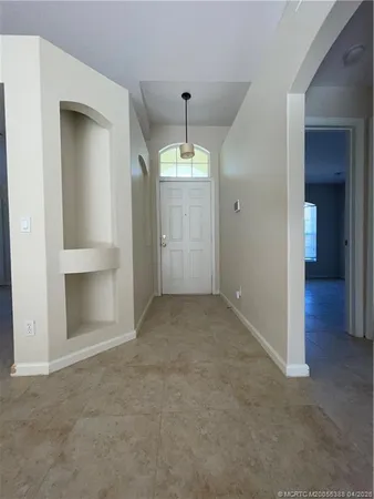 an empty room that has a kitchen