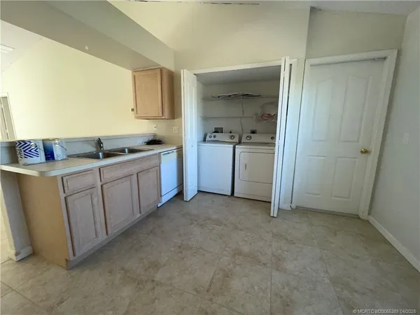 a room with a sink and cabinets