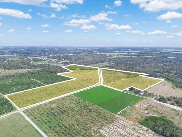 a view of a lake with a big yard