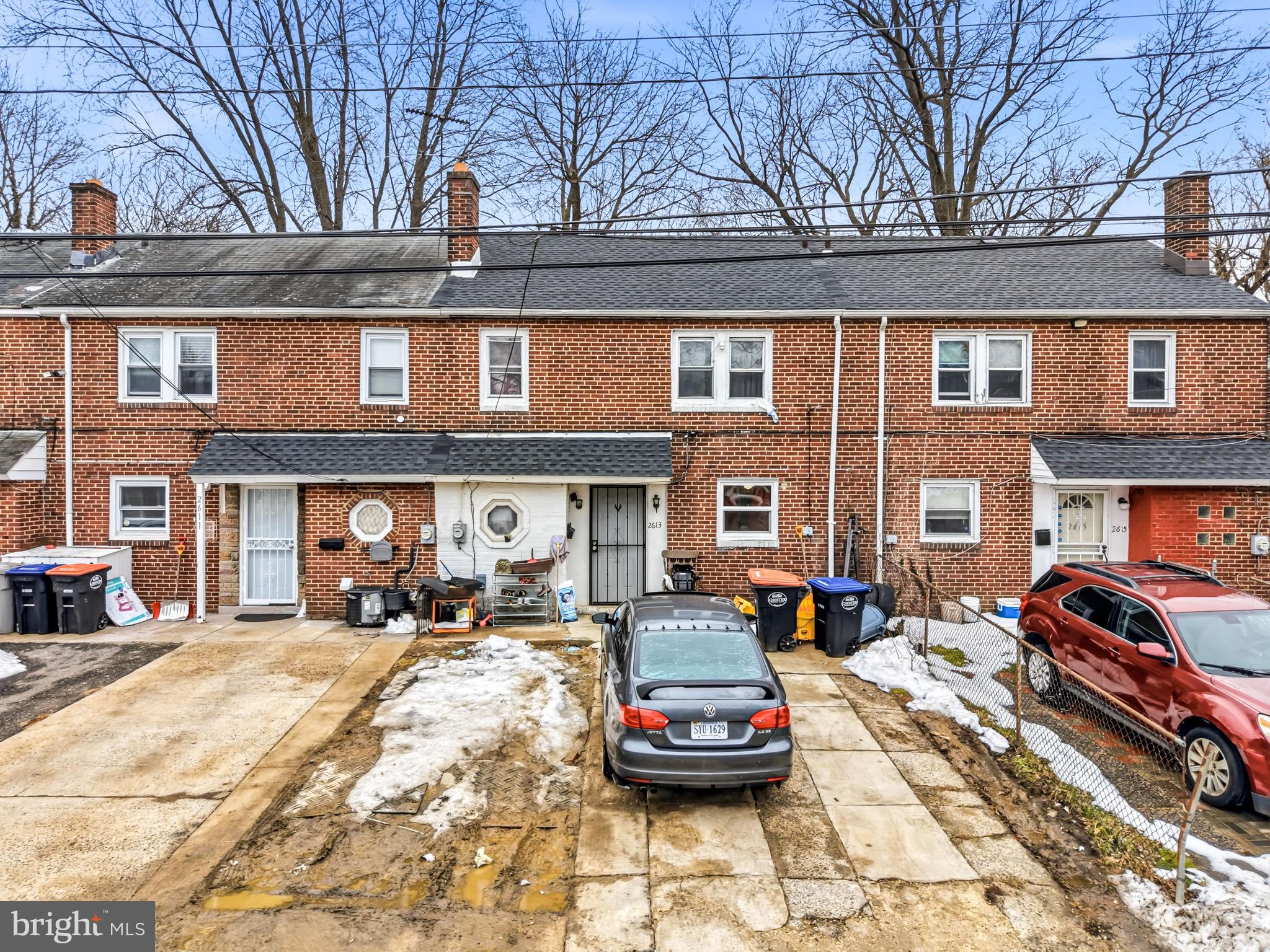 2613 Smithers Street Chester, PA 19013 - Photo 2 of 3 a car parked in front of a building