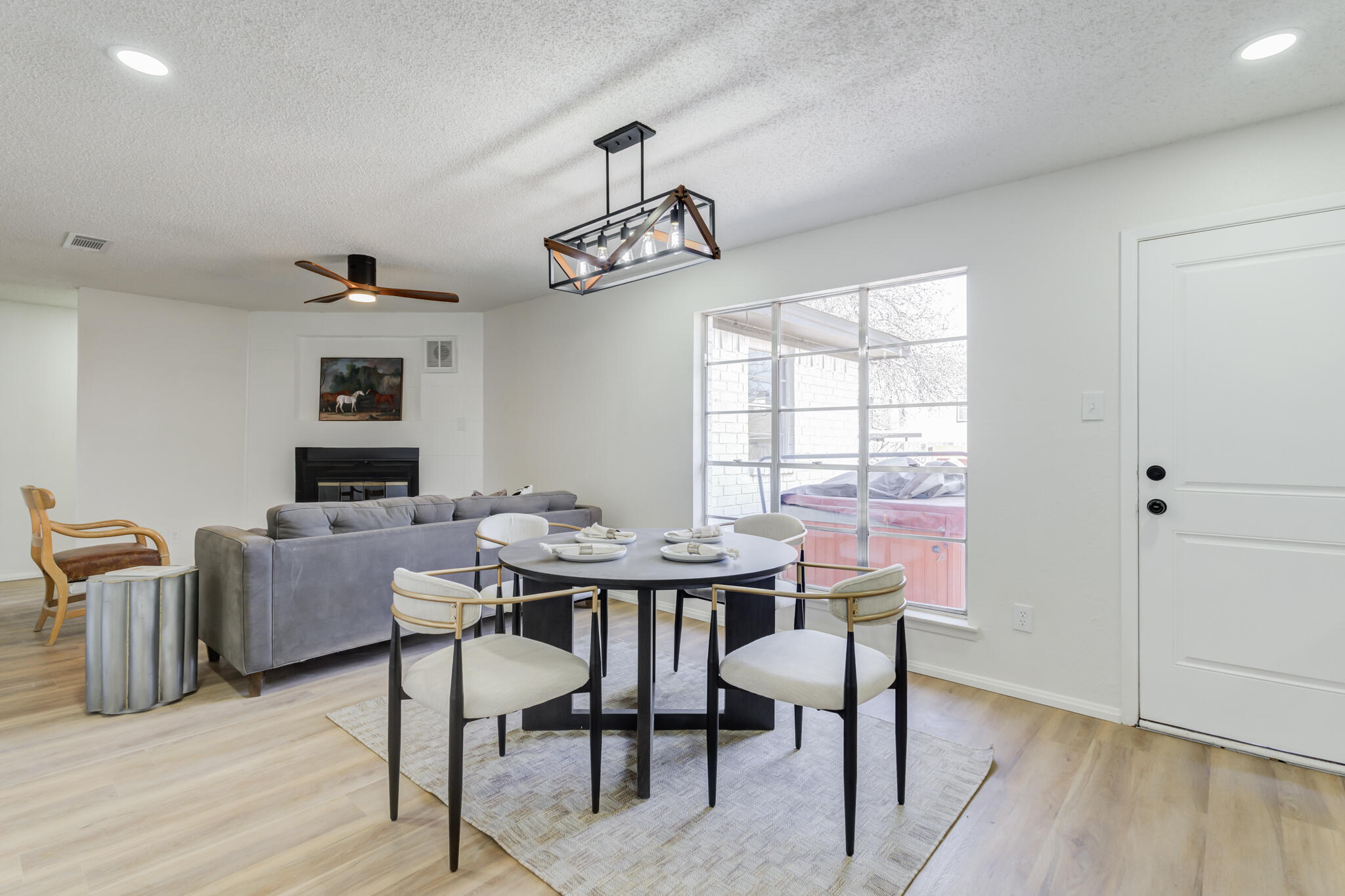 2314 77th Street Lubbock, TX 79423 - Photo 11 of 41 a view of a dining room with furniture window and wooden floor