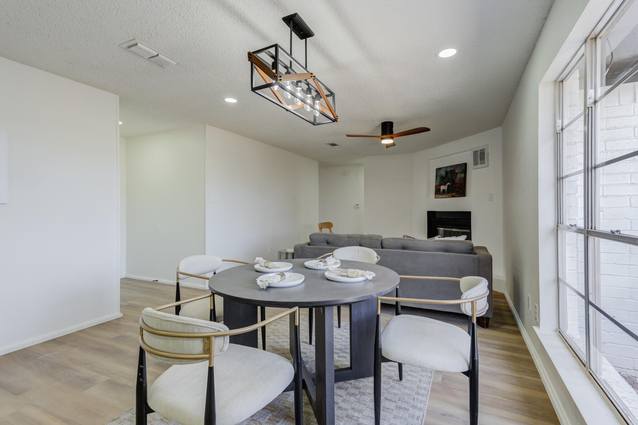 2314 77th Street Lubbock, TX 79423 - Photo 12 of 41 a view of a dining room with furniture and wooden floor