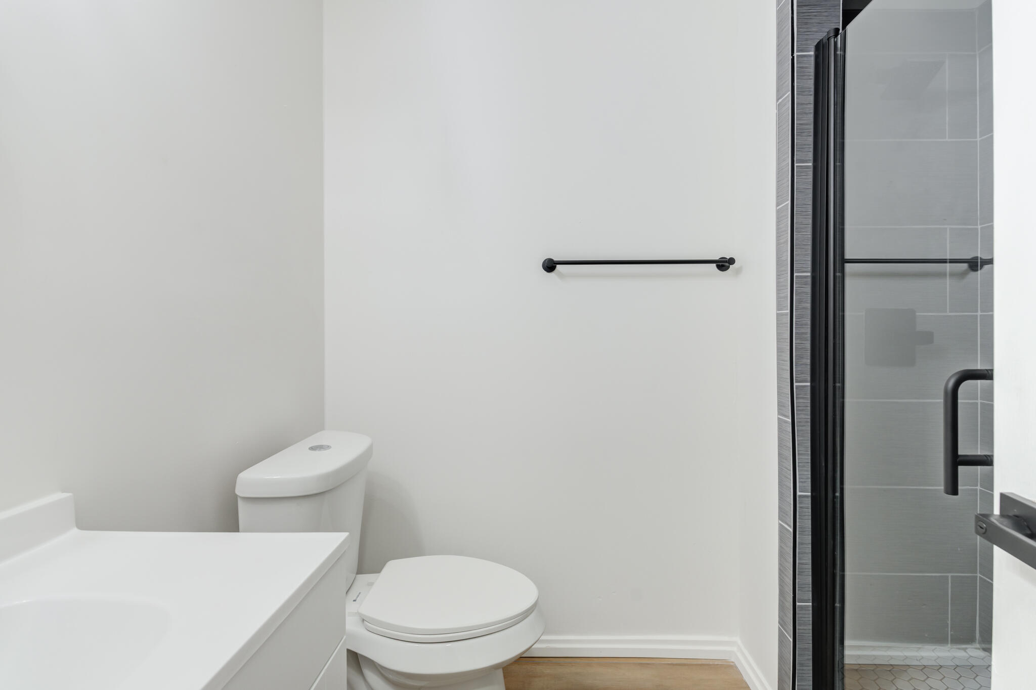2314 77th Street Lubbock, TX 79423 - Photo 20 of 41 a white toilet sitting next to a shower