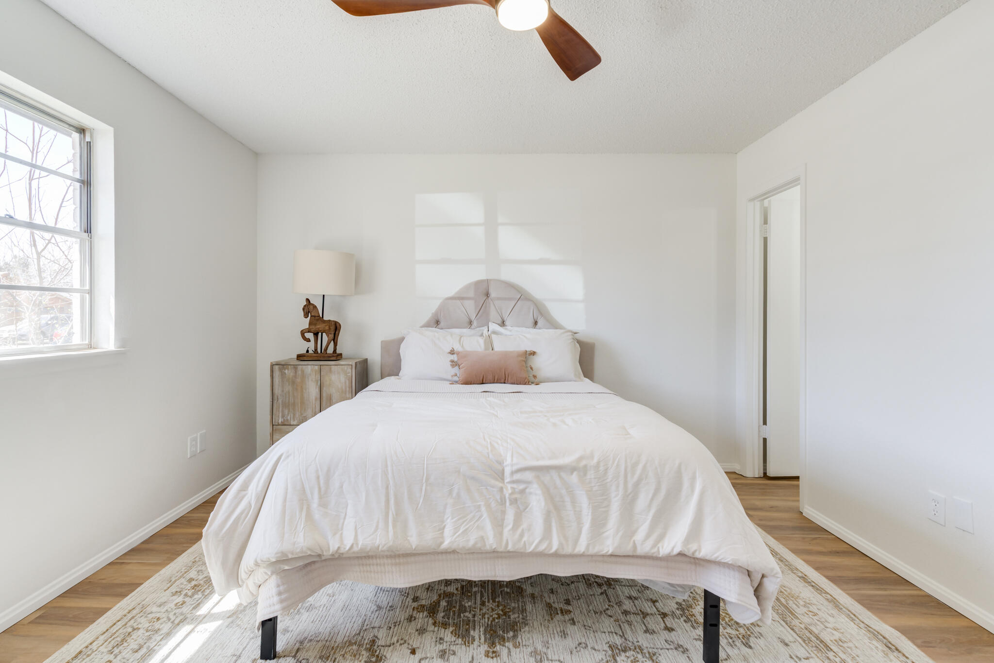 2314 77th Street Lubbock, TX 79423 - Photo 31 of 41 a bedroom with a bed and a window