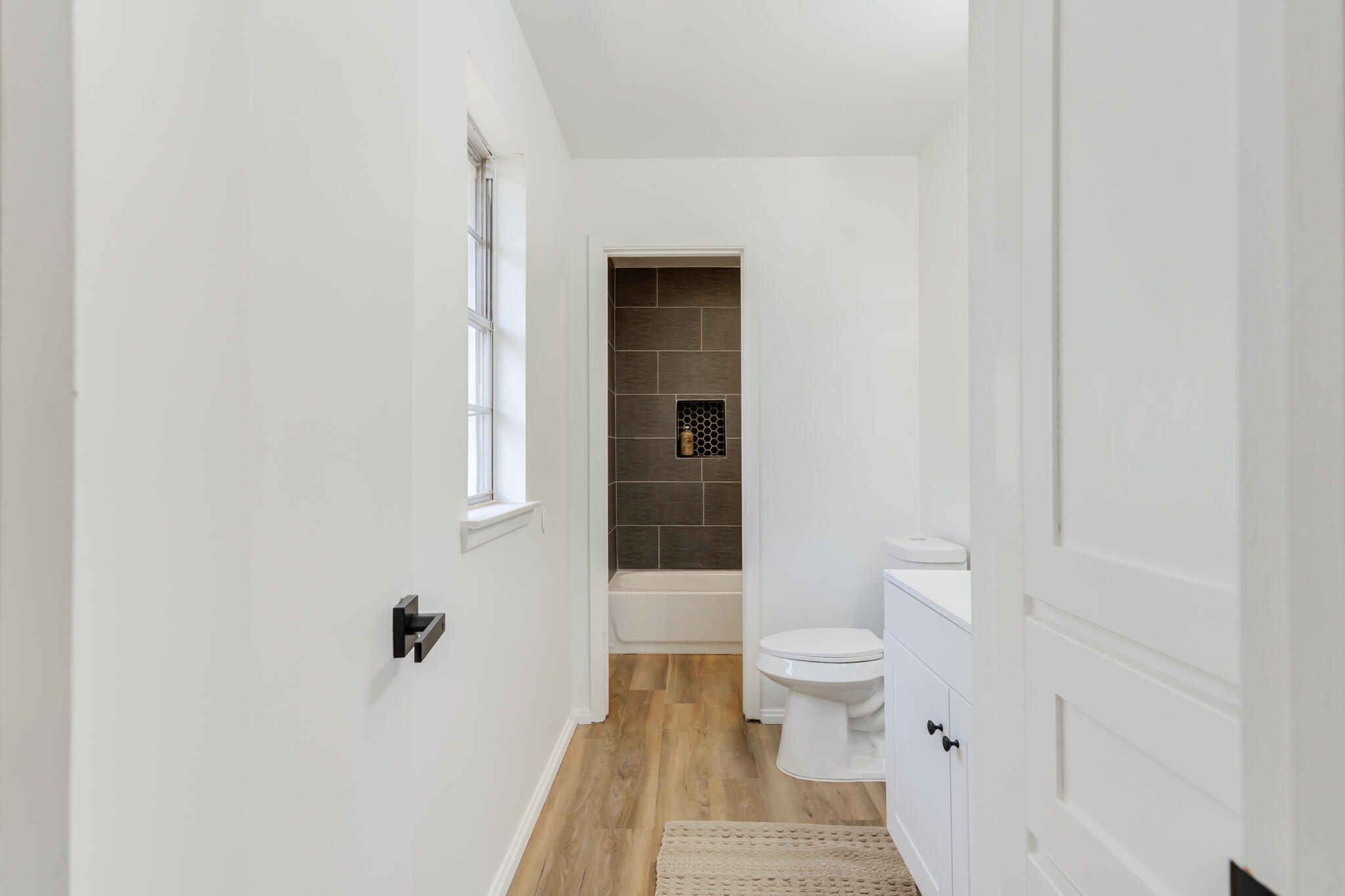 2314 77th Street Lubbock, TX 79423 - Photo 35 of 41 a bathroom with a toilet and a sink