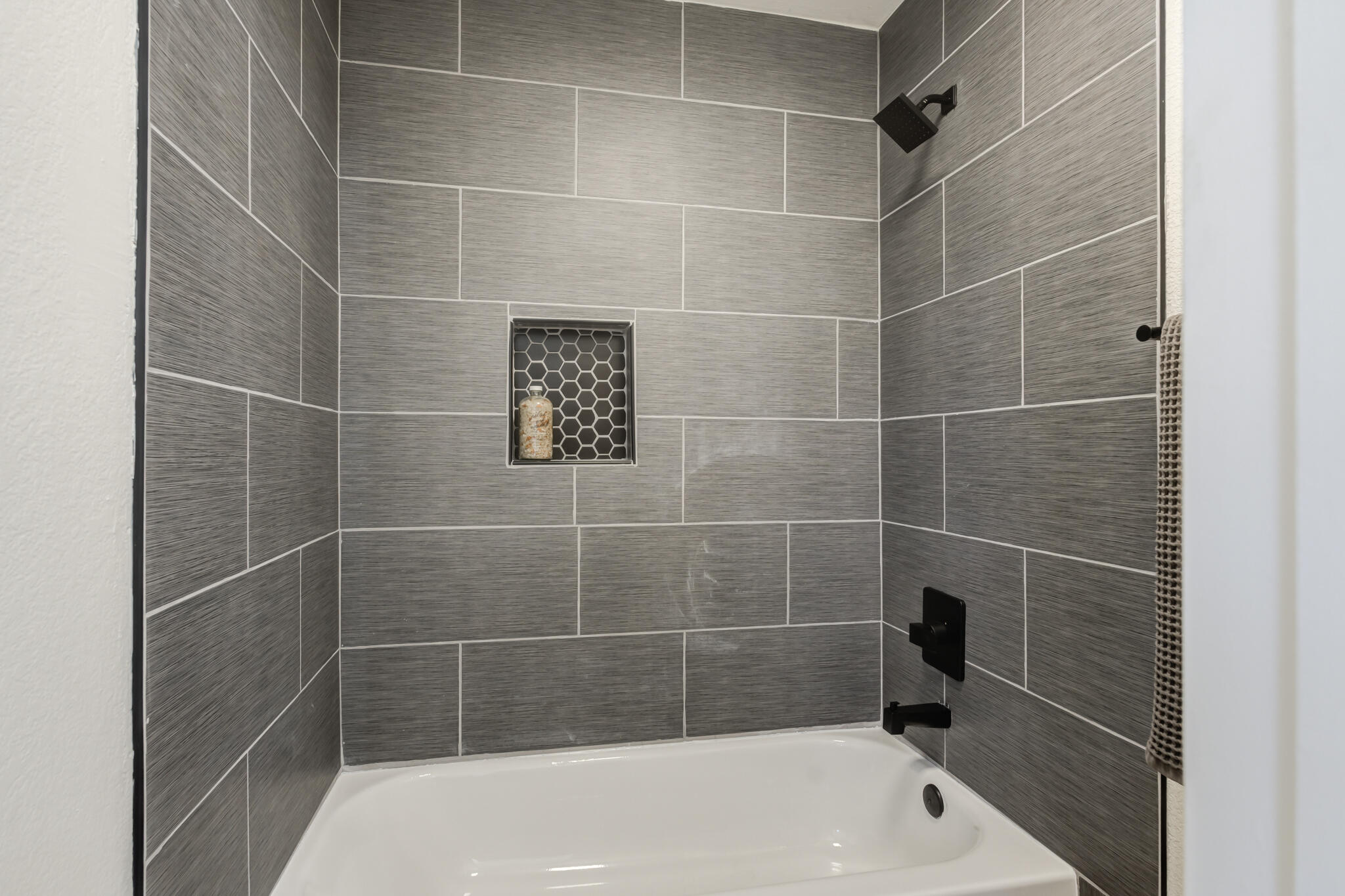 2314 77th Street Lubbock, TX 79423 - Photo 36 of 41 a bath tub sitting next to a shower