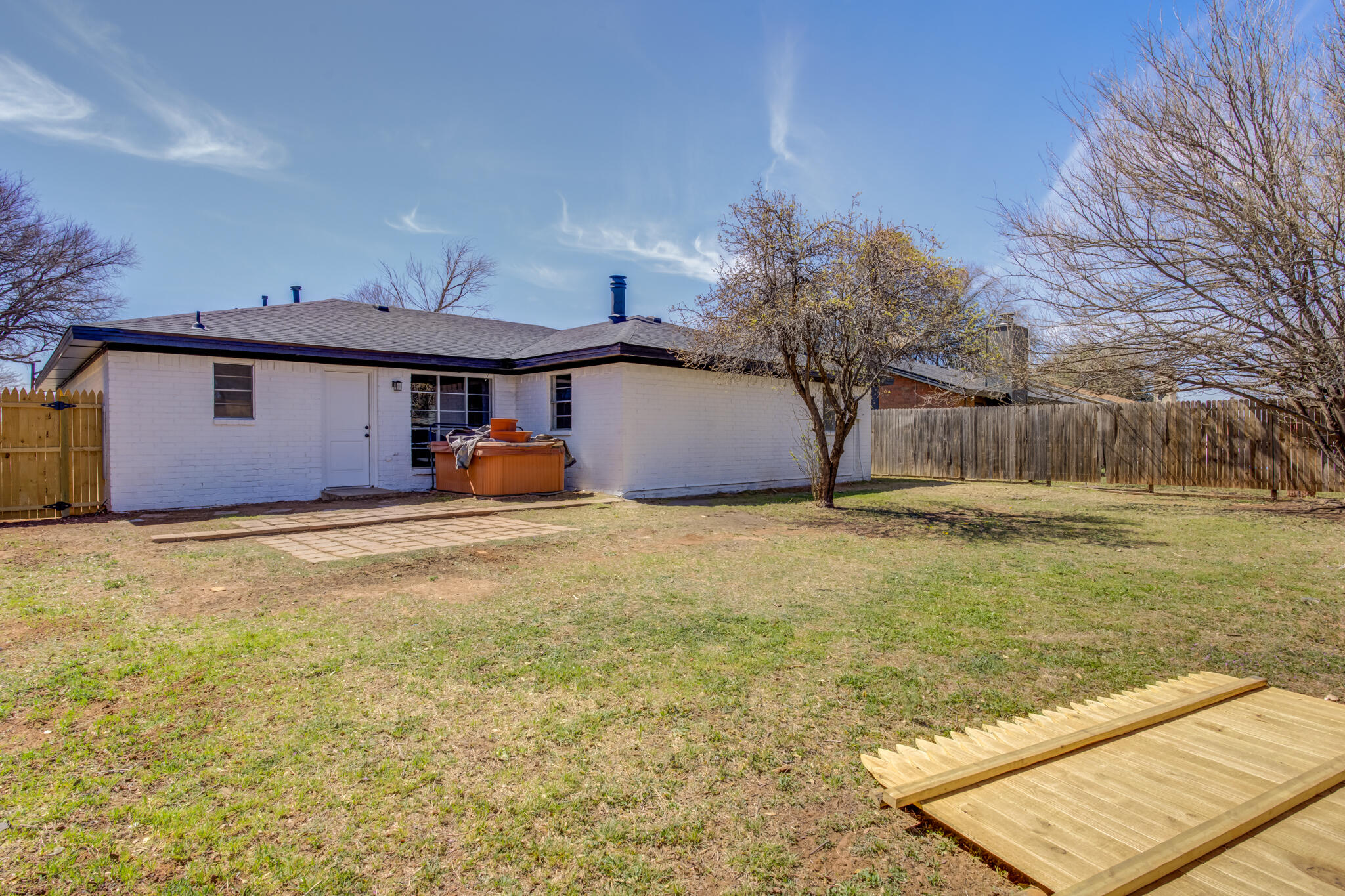 2314 77th Street Lubbock, TX 79423 - Photo 40 of 41 a front view of a house with large garden