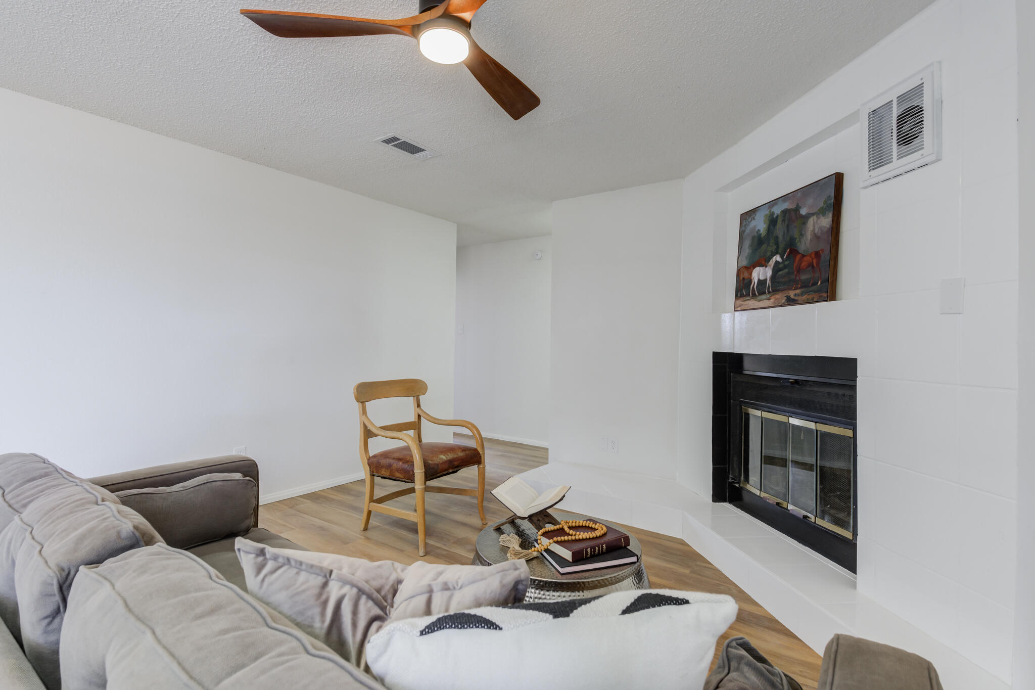 2314 77th Street Lubbock, TX 79423 - Photo 5 of 41 a living room with furniture and a fireplace