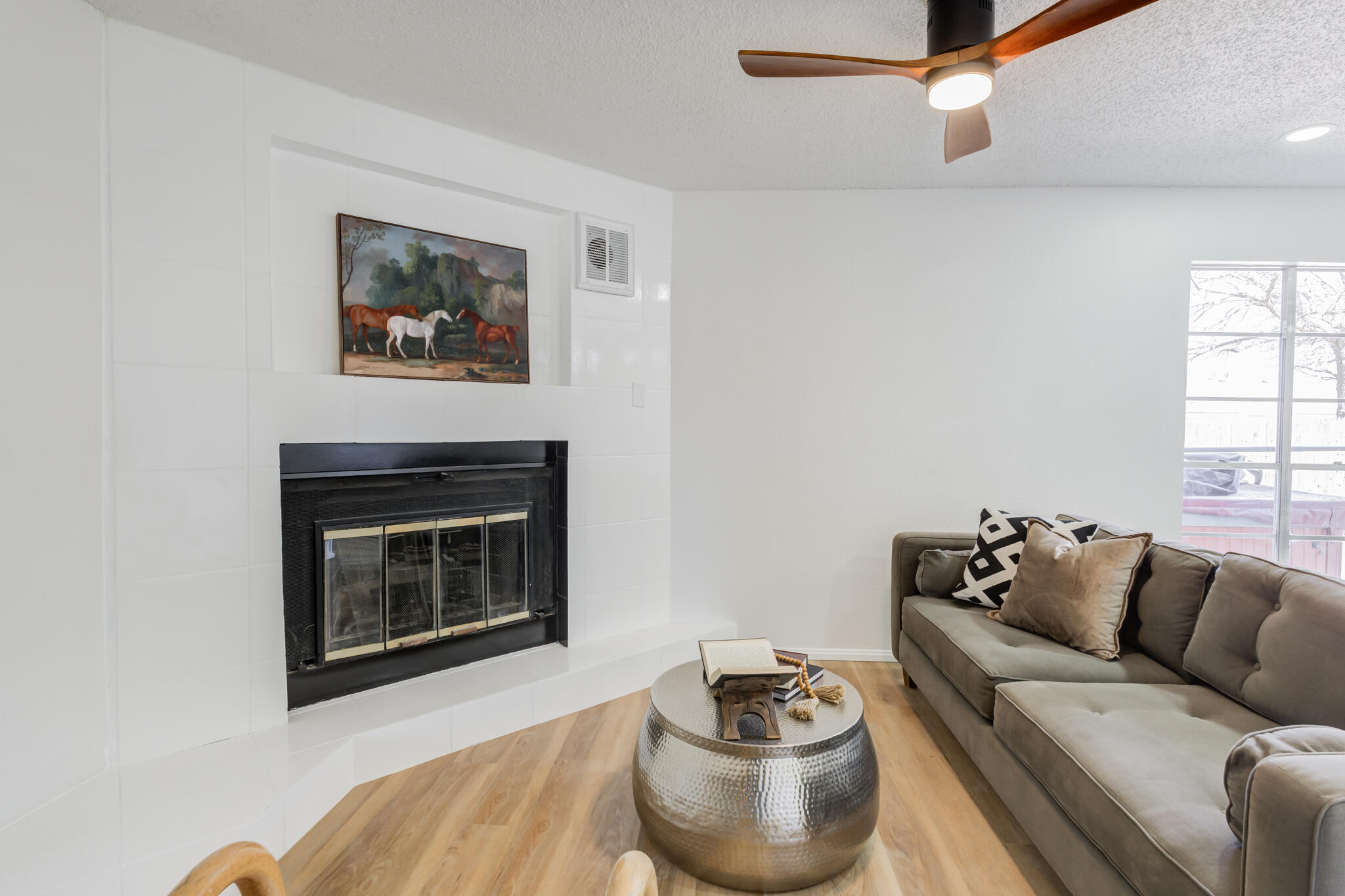 2314 77th Street Lubbock, TX 79423 - Photo 6 of 41 a living room with furniture and a fireplace