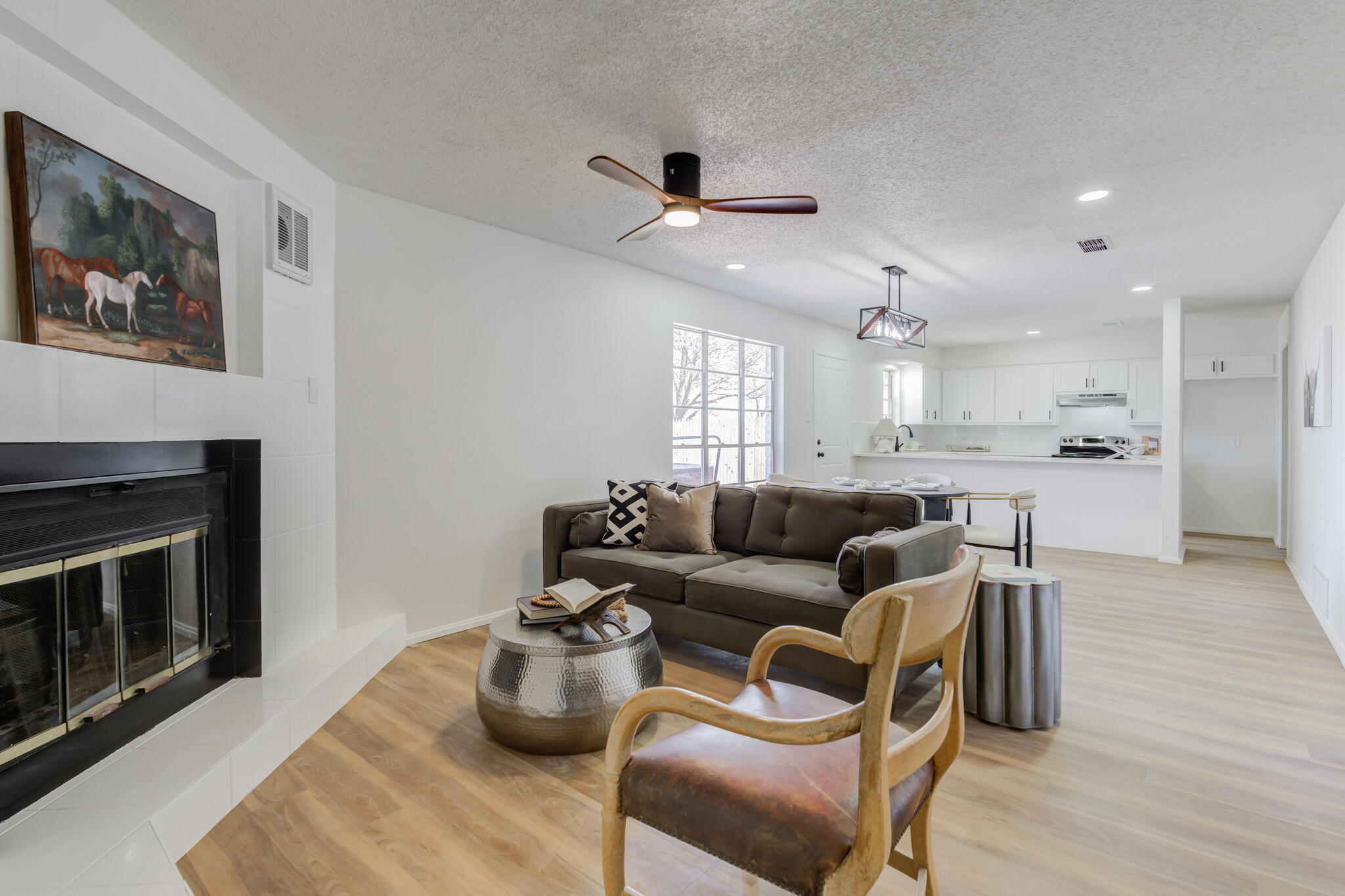 2314 77th Street Lubbock, TX 79423 - Photo 7 of 41 a living room with furniture and a fireplace