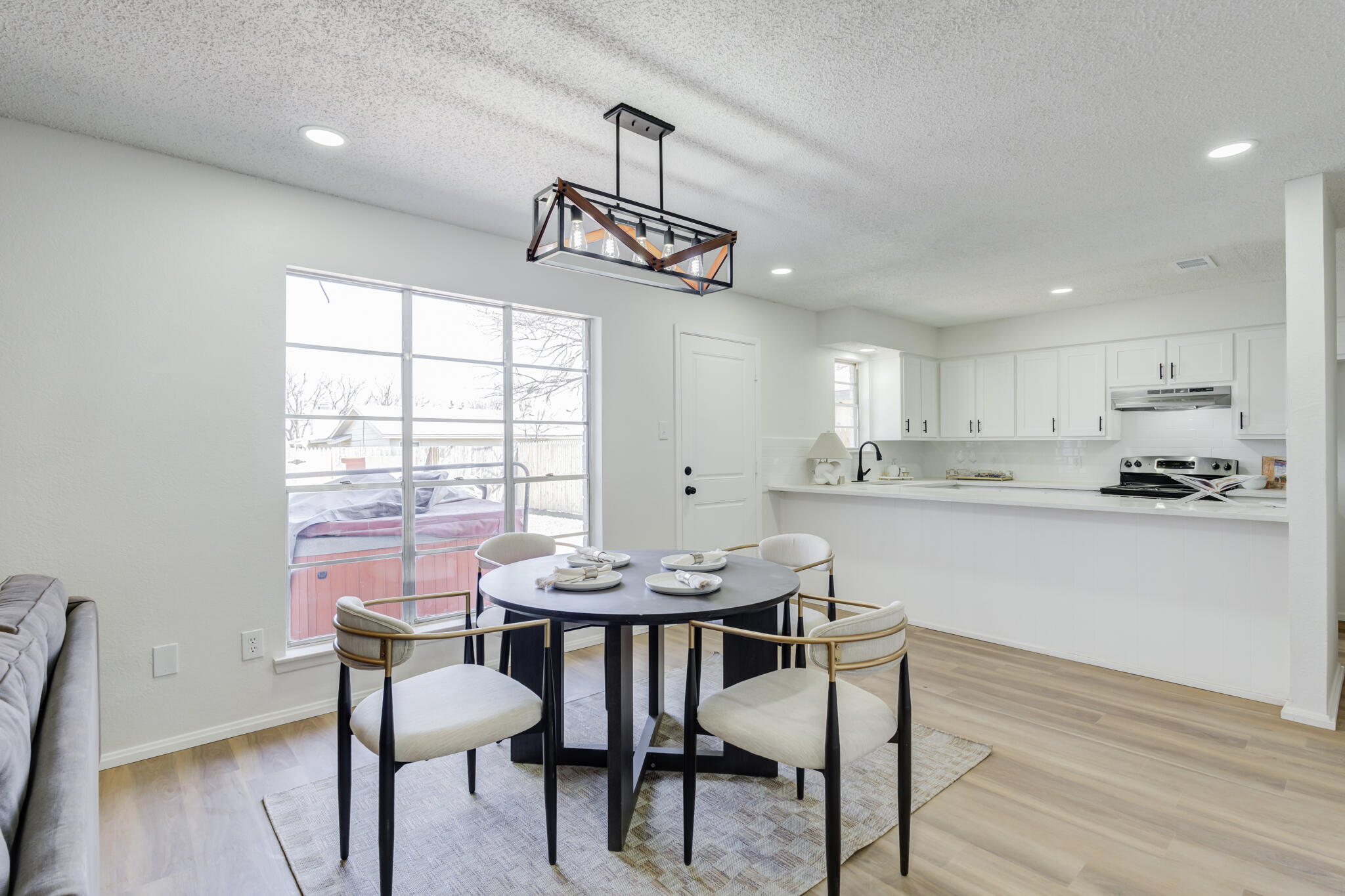 2314 77th Street Lubbock, TX 79423 - Photo 9 of 41 a view of a dining room with furniture window and wooden floor