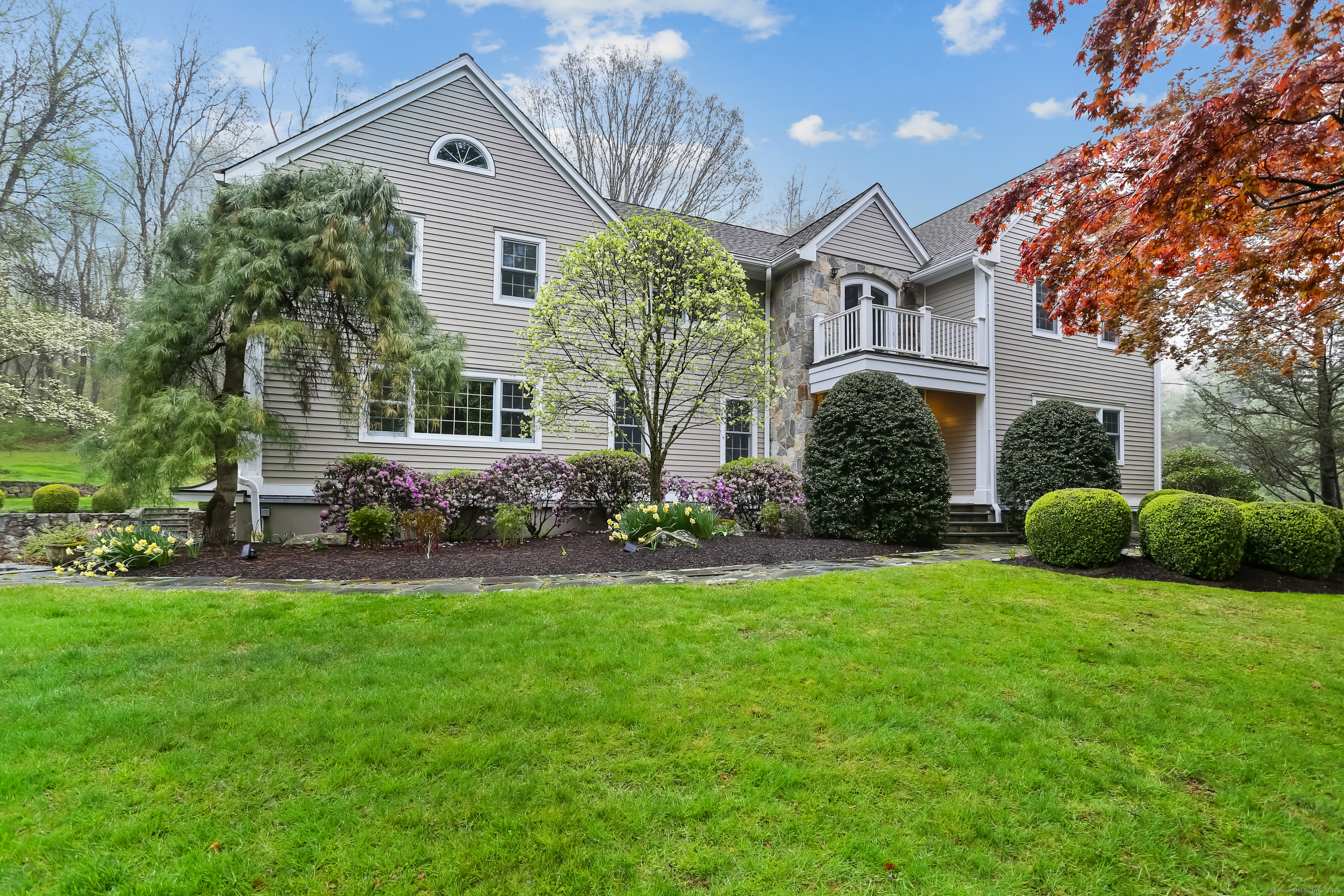 9 Blue Spruce Circle Weston, CT 06883 - Photo 1 of 1 a front view of house with yard and green space