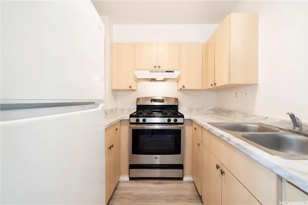 a kitchen with a stove and a sink