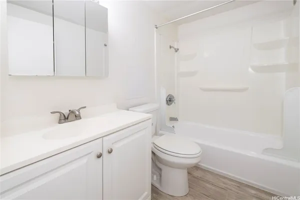 a bathroom with a sink a toilet and a bathtub