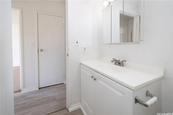 a bathroom with a sink and mirror
