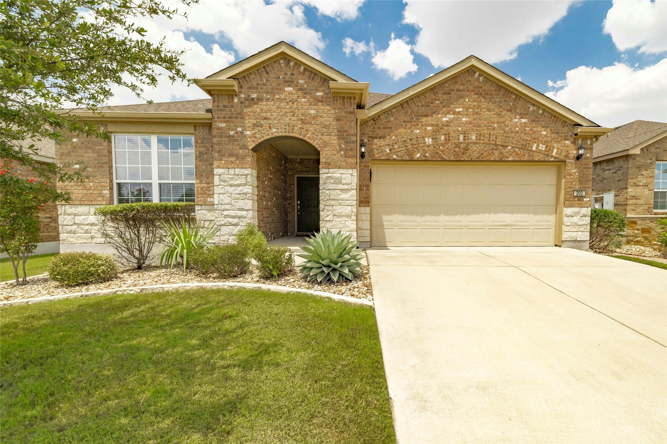 203 Longview Lane Georgetown, TX 78633 - Photo 1 of 37 a front view of a house with garden