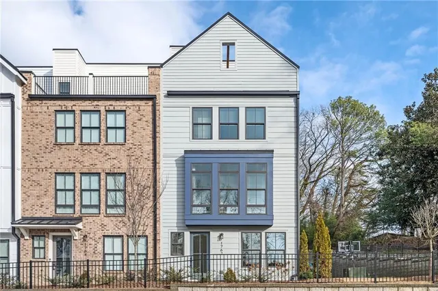 a front view of residential houses with street