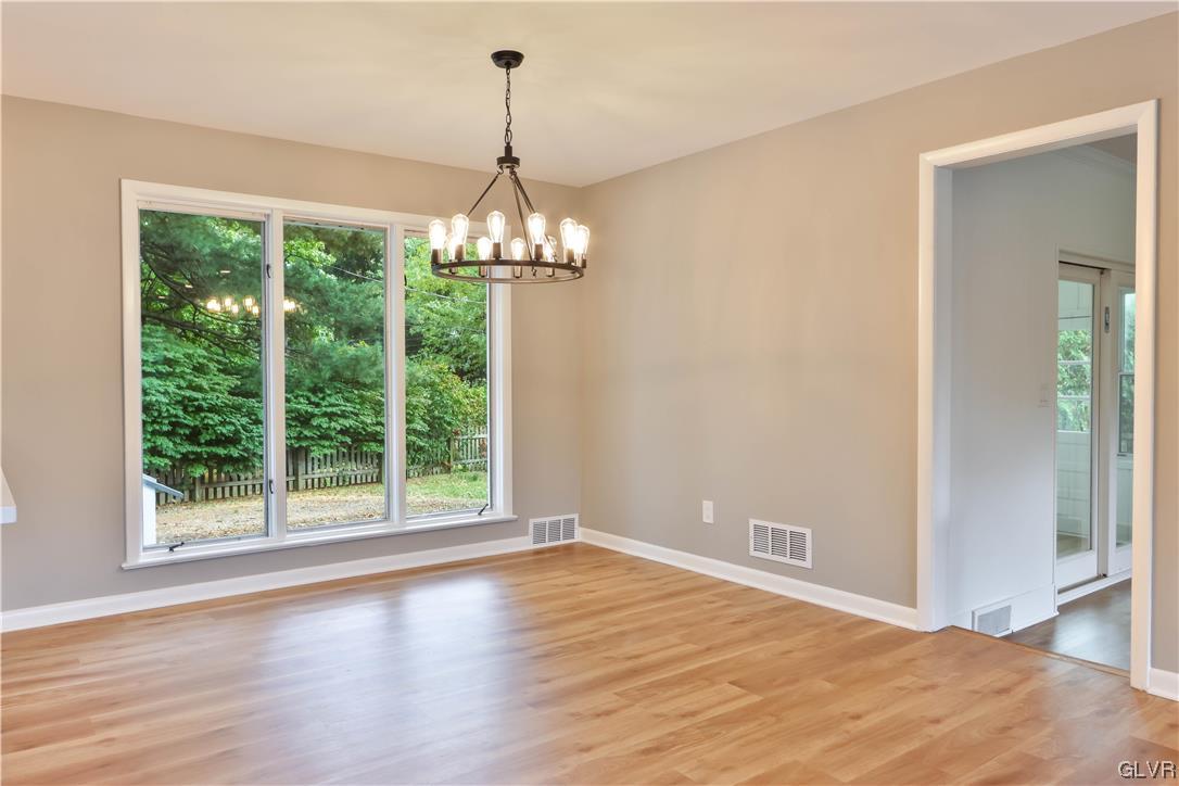 403 Barrett Road Emmaus, PA 18049 - Photo 13 of 44 a view of empty room with wooden floor and fan