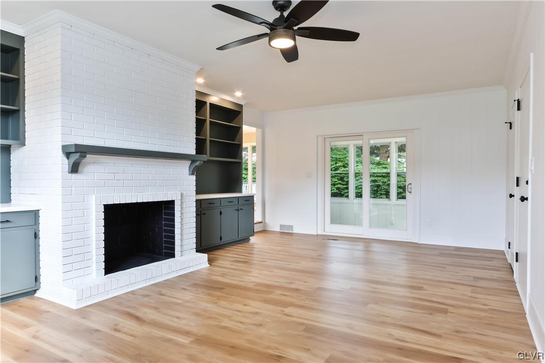 403 Barrett Road Emmaus, PA 18049 - Photo 14 of 44 a view of an empty room with a fireplace and window
