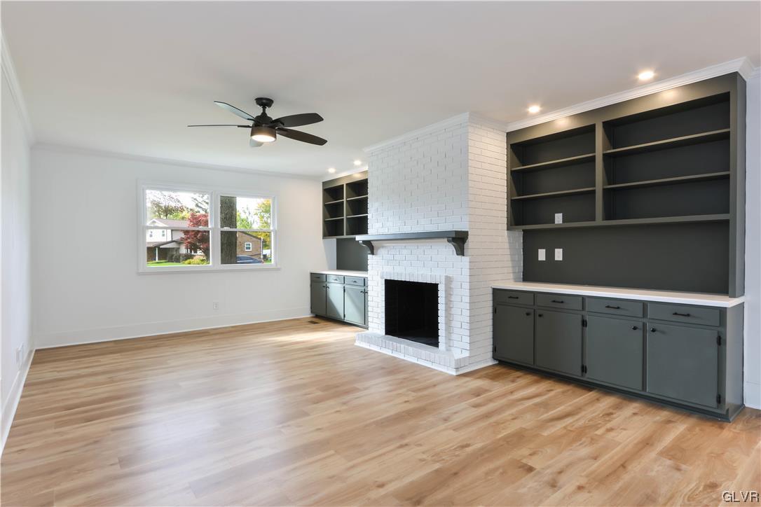 403 Barrett Road Emmaus, PA 18049 - Photo 15 of 44 a view of an empty room with a fireplace and a window