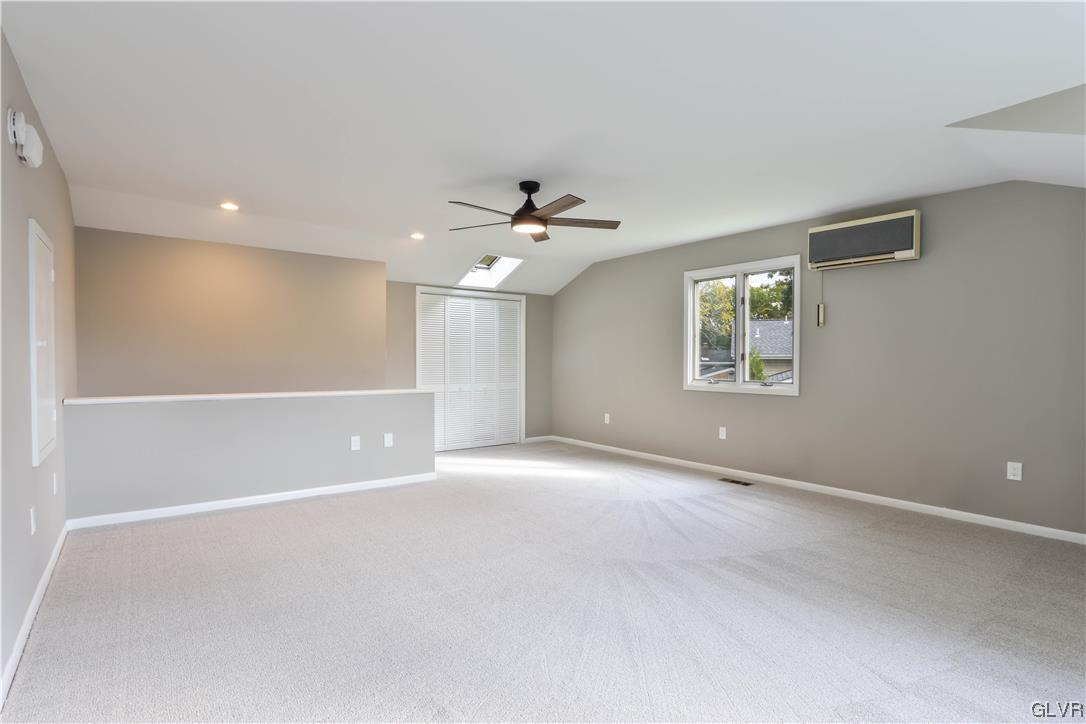 403 Barrett Road Emmaus, PA 18049 - Photo 20 of 44 an empty room with windows and ceiling fan