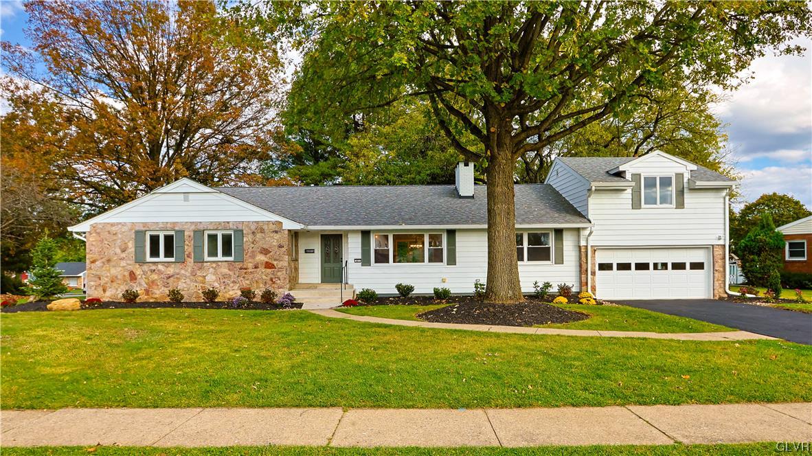 403 Barrett Road Emmaus, PA 18049 - Photo 2 of 44 a front view of a house with a garden