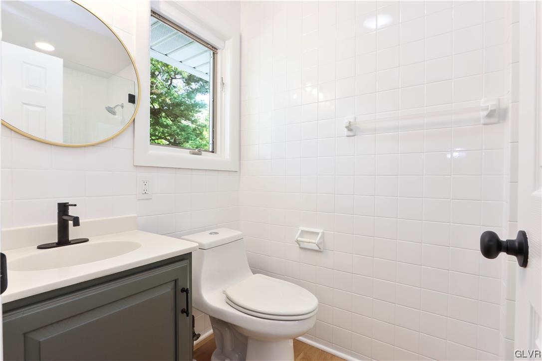 403 Barrett Road Emmaus, PA 18049 - Photo 23 of 44 a bathroom with a sink a toilet and mirror