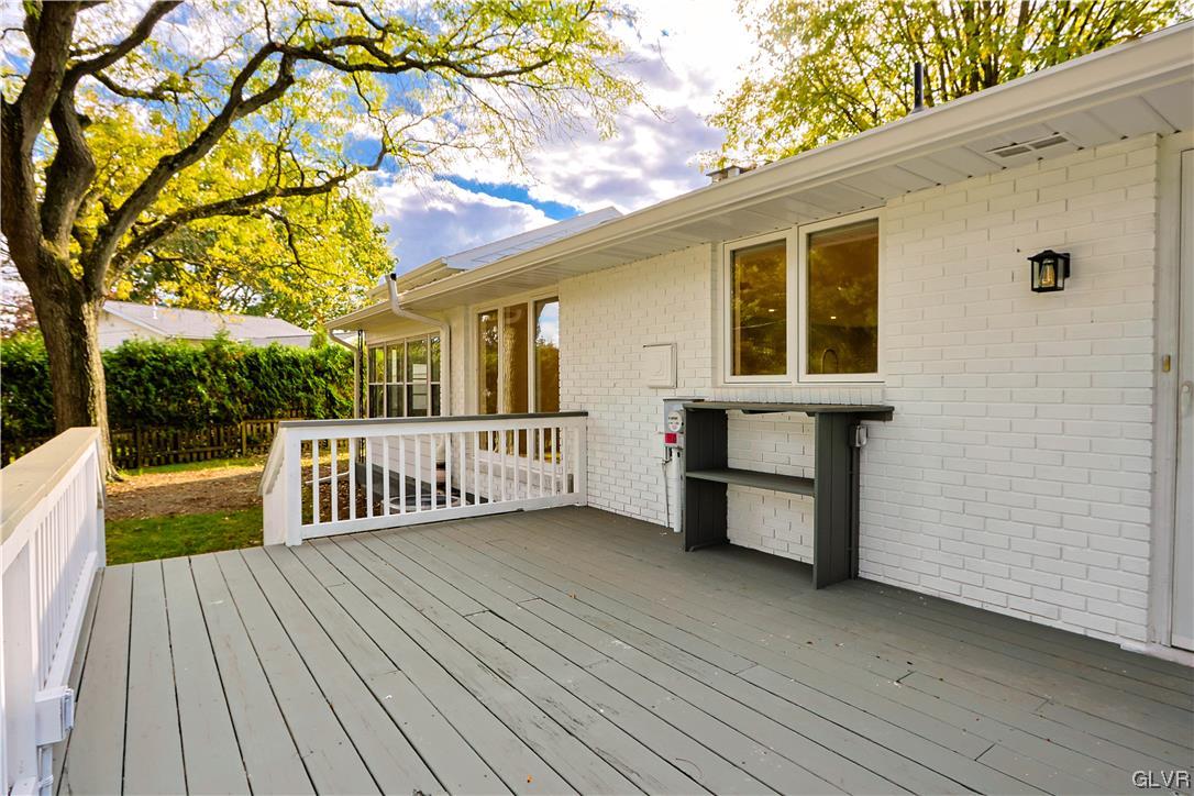 403 Barrett Road Emmaus, PA 18049 - Photo 44 of 44 a view of a deck with wooden floor and fence next to a yard